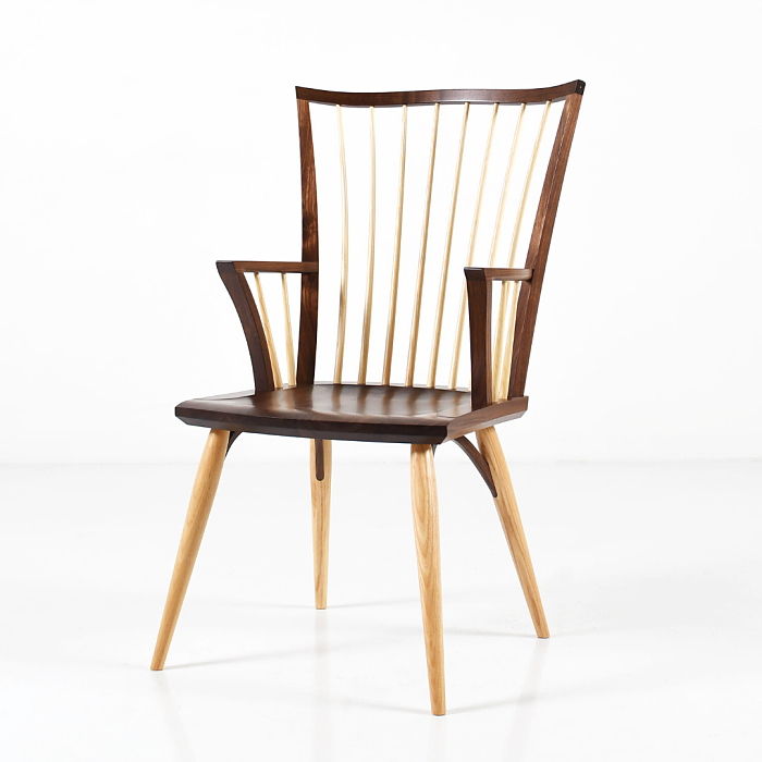 Catena Arm Chair in walnut turned to the left