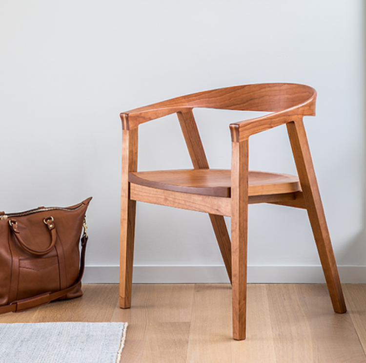 New York public library chair in cherry with a leather briefcase to the left