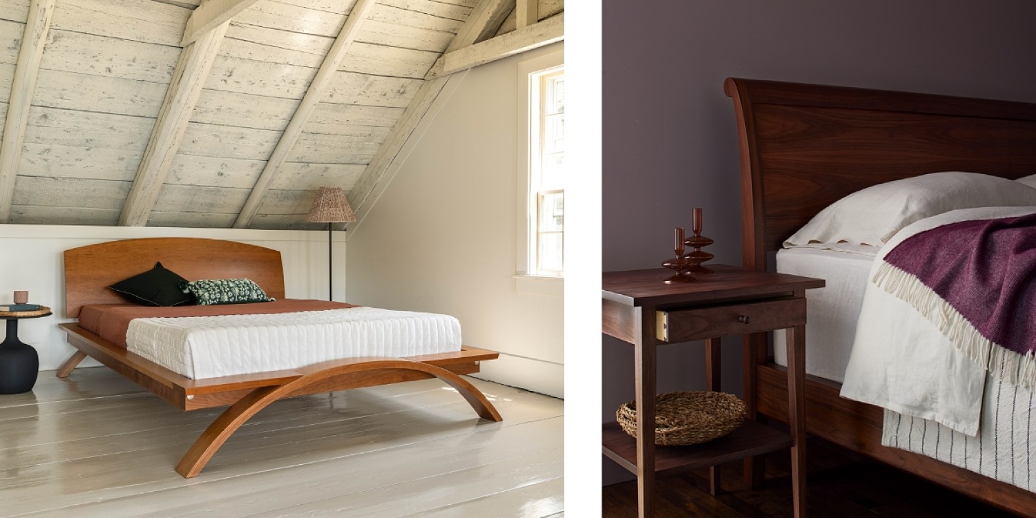 Two styled bed photos. Left: the Vita bed in cherry. Vita features a low platform and a curved foot and headboard. Beside the bed is a black bulbous side table with eyeglasses. there is a window to the right of the room. Right: The sleigh bed and square end table with drawer. The Sleigh bed has a curved headboard with white and eggplant colored blankets and white pillows. The side table's drawer is pulled out showing the dovetail details of the drawer, there is a shelf under the drawer and on top of the side table is an amber glass candle holder. the room is an eggplant color.