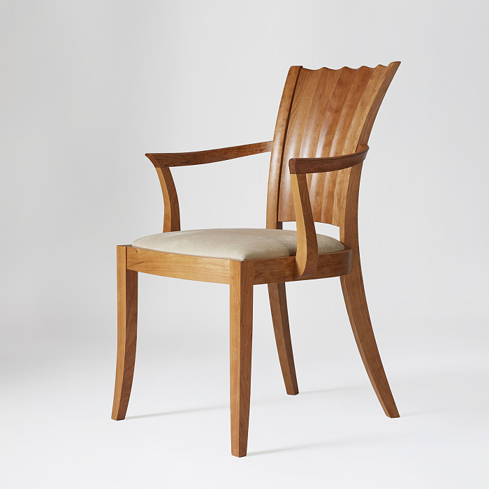 Aria Arm Chair in Cherry on white background.